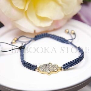 Juicy Couture Pave Hamsa Hand Friendship Bracelet.